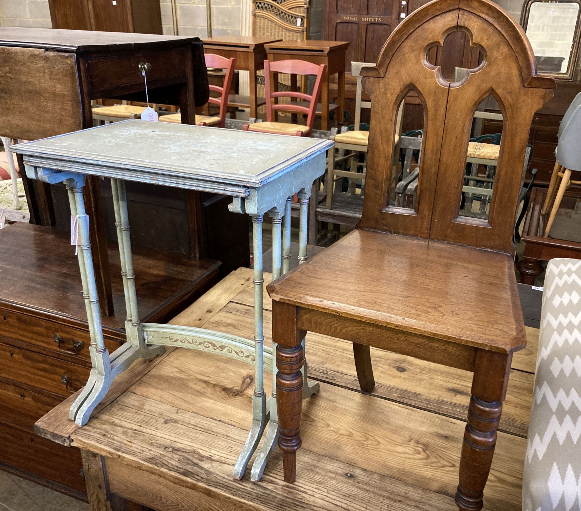 A nest of two painted rectangular tea tables and a Victorian Gothic style walnut hall chair